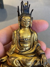 A small Sino-Tibetan gilt bronze Buddha, 19th C.