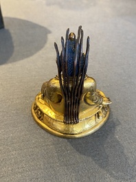 A small Sino-Tibetan gilt bronze Buddha, 19th C.
