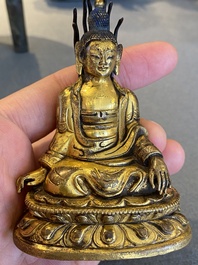 A small Sino-Tibetan gilt bronze Buddha, 19th C.