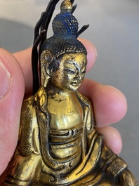 A small Sino-Tibetan gilt bronze Buddha, 19th C.