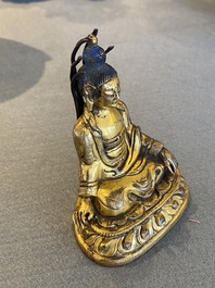 A small Sino-Tibetan gilt bronze Buddha, 19th C.