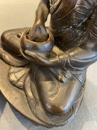A Tibetan lacquered bronze Medicine Buddha or Bhaishajyaguru, 19th C.