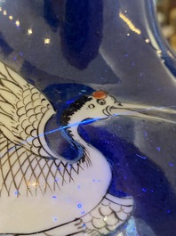A pair of Chinese famille verte powder-blue-ground vases, 19th C.