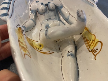 A polychrome French faience oval basin with a bathing woman, Nevers, 17th C.