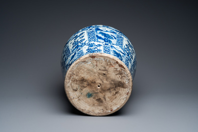 A large Chinese blue and white garniture of three vases, Kangxi