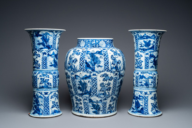 A large Chinese blue and white garniture of three vases, Kangxi