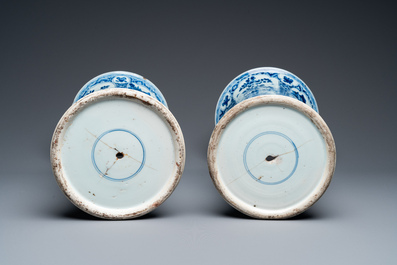 A large Chinese blue and white garniture of three vases, Kangxi