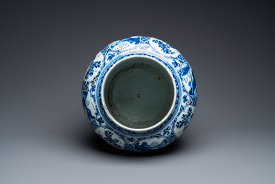 A large Chinese blue and white garniture of three vases, Kangxi