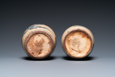A pair of Vietnamese Bat Trang stoneware bottle vases with clouds, 19th C.
