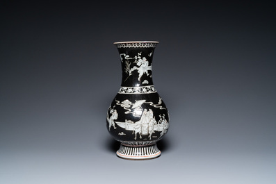 A Chinese famille noire vase with grisaille and iron-red design, 19th C.