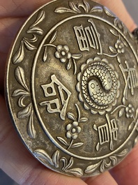 A Chinese reticulated jade 'three peacocks' carving in silver pendant, Qing