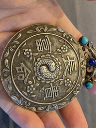 A Chinese reticulated jade 'three peacocks' carving in silver pendant, Qing