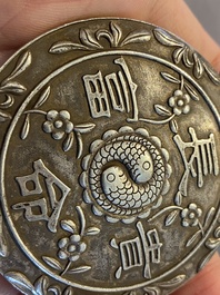 A Chinese reticulated jade 'three peacocks' carving in silver pendant, Qing