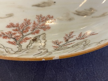 A pair of Chinese iron-red and grisaille 'boy on buffalo' plates, Qianlong