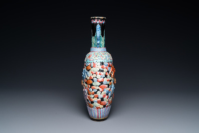 A Chinese famille rose vase with molded design of Buddhist lions, Qianlong mark, 19th C.