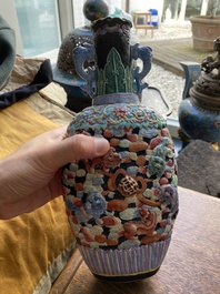 A Chinese famille rose vase with molded design of Buddhist lions, Qianlong mark, 19th C.
