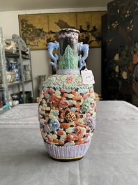 A Chinese famille rose vase with molded design of Buddhist lions, Qianlong mark, 19th C.