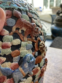 A Chinese famille rose vase with molded design of Buddhist lions, Qianlong mark, 19th C.