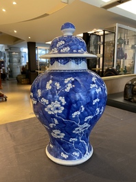 A Chinese blue and white 'prunus on cracked ice' vase and cover, Kangxi