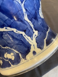 A Chinese blue and white 'prunus on cracked ice' vase and cover, Kangxi