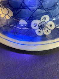 A Chinese blue and white 'prunus on cracked ice' vase and cover, Kangxi