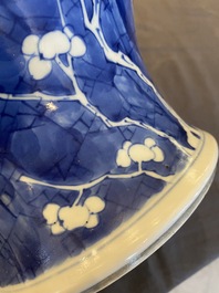 A Chinese blue and white 'prunus on cracked ice' vase and cover, Kangxi