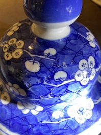 A Chinese blue and white 'prunus on cracked ice' vase and cover, Kangxi