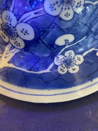 A Chinese blue and white 'prunus on cracked ice' vase and cover, Kangxi