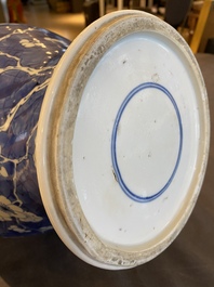 A Chinese blue and white 'prunus on cracked ice' vase and cover, Kangxi