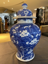 A Chinese blue and white 'prunus on cracked ice' vase and cover, Kangxi