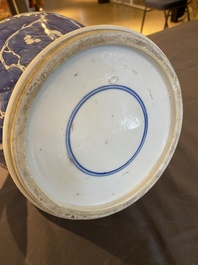 A Chinese blue and white 'prunus on cracked ice' vase and cover, Kangxi
