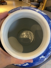 A Chinese blue and white 'prunus on cracked ice' vase and cover, Kangxi