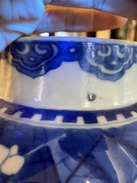 A Chinese blue and white 'prunus on cracked ice' vase and cover, Kangxi