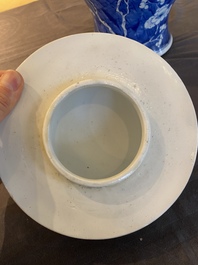 A Chinese blue and white 'prunus on cracked ice' vase and cover, Kangxi