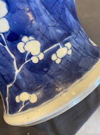 A Chinese blue and white 'prunus on cracked ice' vase and cover, Kangxi