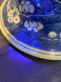 A Chinese blue and white 'prunus on cracked ice' vase and cover, Kangxi
