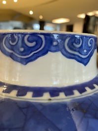 A Chinese blue and white 'prunus on cracked ice' vase and cover, Kangxi