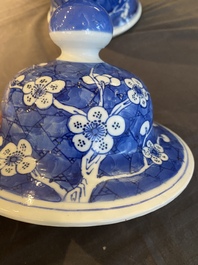 A Chinese blue and white 'prunus on cracked ice' vase and cover, Kangxi