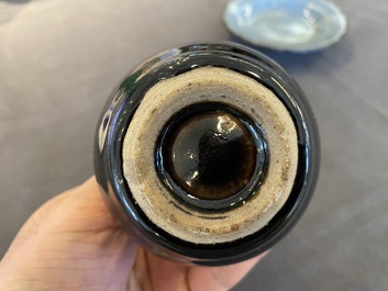 A small Chinese black-glazed double gourd vase and a blue crackle-glazed saucer dish, Qing