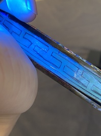 A Chinese Canton enamel hand mirror, inscribed 'Dan Na', Qianlong