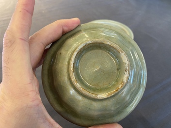 Two Chinese celadon-glazed bowls, one with twin fish, Ming