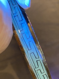 A Chinese Canton enamel hand mirror, inscribed 'Dan Na', Qianlong