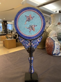A Chinese Canton enamel hand mirror, inscribed 'Dan Na', Qianlong