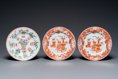 A Chinese blue and white 'dragon' dish and three iron-red and famille rose plates, 18th C.