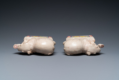 A pair of Chinese famille rose elephants on stands, 20th C.