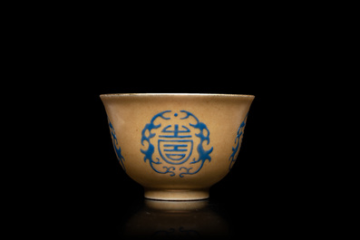 A Chinese blue enamel on gilt &lsquo;Shou&rsquo; tea bowl, 18/19th C.