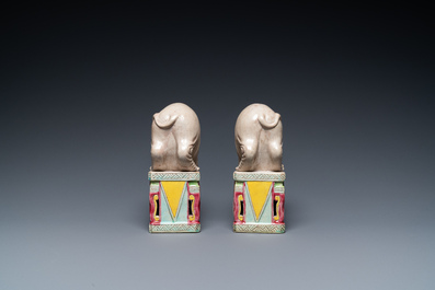 A pair of Chinese famille rose elephants on stands, 20th C.