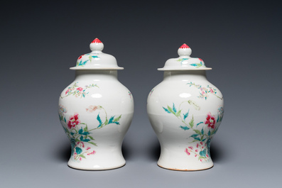 A pair of fine Chinese famille rose vases and covers, 19th C.