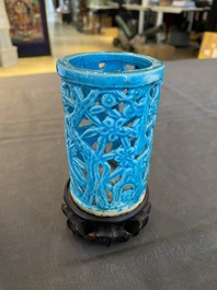 A Chinese reticulated monochrome turquoise brush pot on wooden stand, Qing