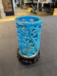 A Chinese reticulated monochrome turquoise brush pot on wooden stand, Qing